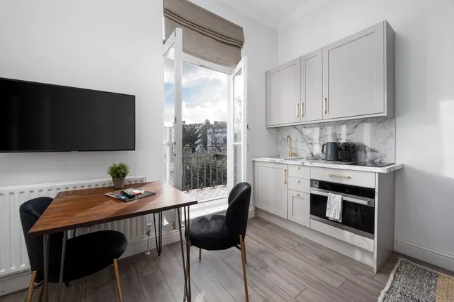 Unbroken freehold building comprising 7 serviced apartments in Notting Hill